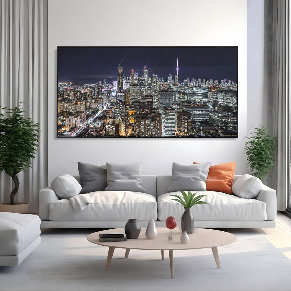 Tablou canvas cu panoramic nocturn cu toronto si cn tower, in rama de aluminiu negru, pe perete intr-un living