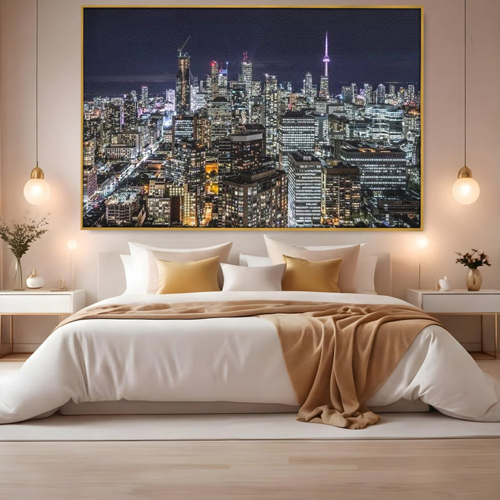 Tablou canvas cu panoramic nocturn cu toronto si cn tower, in rama de aluminiu auriu, pe perete intr-un dormitor
