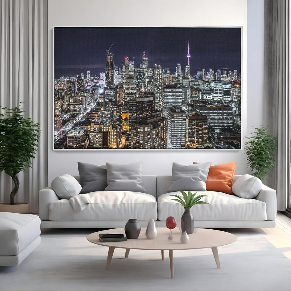 Tablou canvas cu panoramic nocturn cu toronto si cn tower, in rama de aluminiu argintiu, pe perete intr-un living