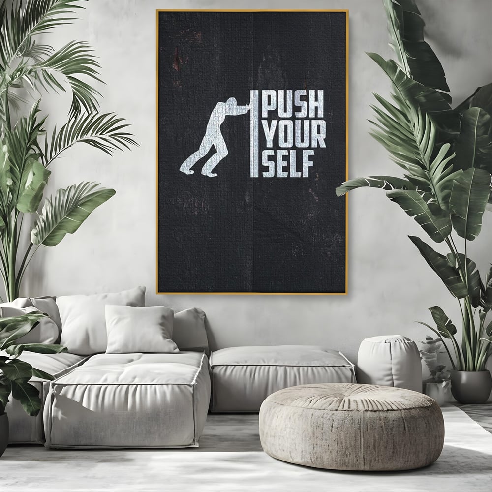 Tablou canvas cu ilustratie motivationala cu silueta care impinge un zid, in rama de aluminiu auriu, pe perete intr-un living
