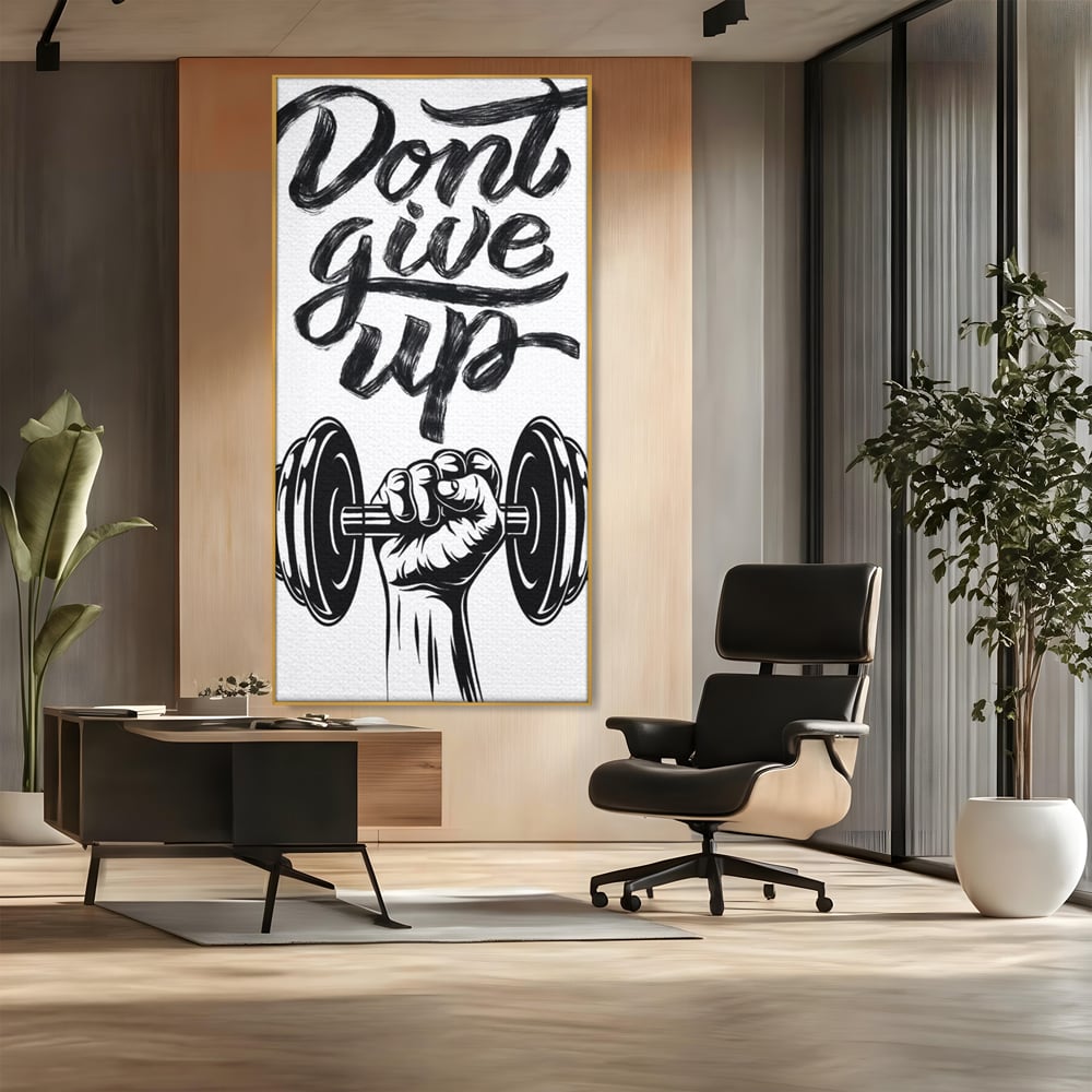 Tablou canvas cu ilustratie motivationala cu halterofil si mesaj, in rama de aluminiu auriu, pe perete intr-un birou