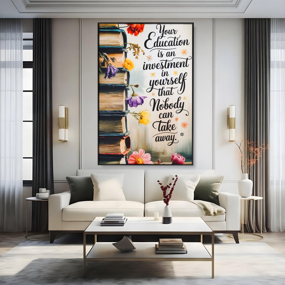 Tablou canvas cu tablou motivational cu teanc de carti si flori, in rama de aluminiu negru, pe perete intr-un living