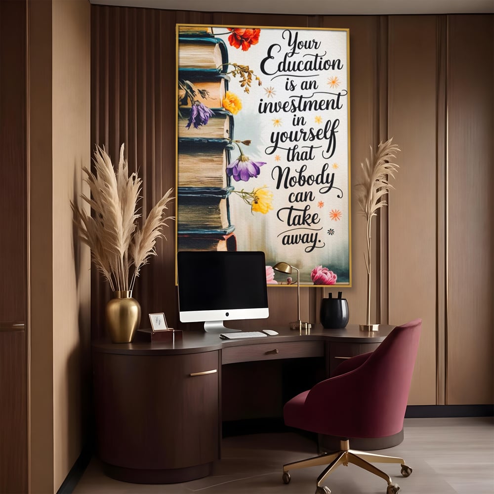 Tablou canvas cu tablou motivational cu teanc de carti si flori, in rama de aluminiu auriu, pe perete intr-un birou
