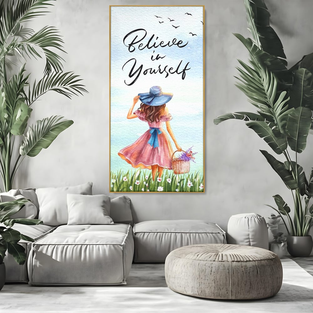 Tablou canvas cu ilustratie cu femeie si mesaj motivational, in rama de aluminiu auriu, pe perete intr-un living