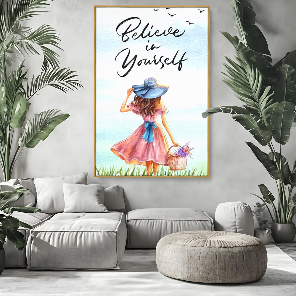Tablou canvas cu ilustratie cu femeie si mesaj motivational, in rama de aluminiu auriu, pe perete intr-un living
