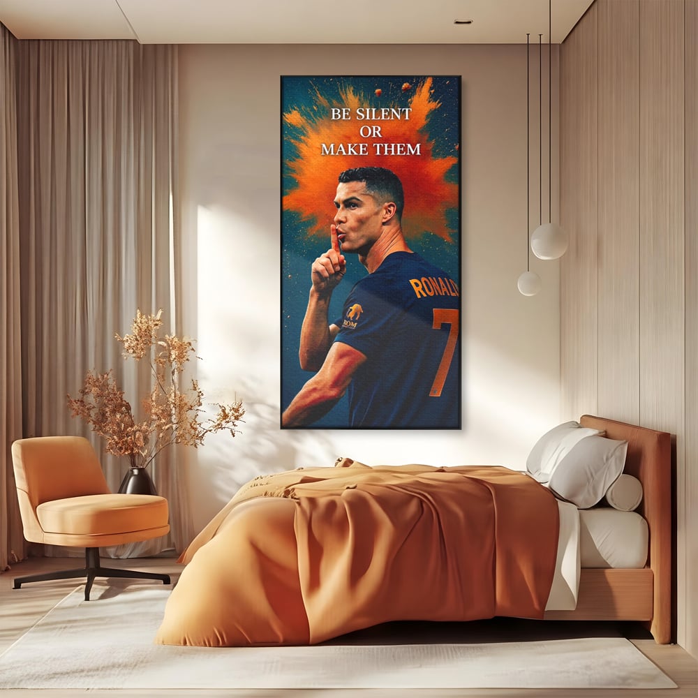Tablou canvas cu tablou motivational cu portretul lui ronaldo, in rama de aluminiu negru, pe perete intr-un dormitor