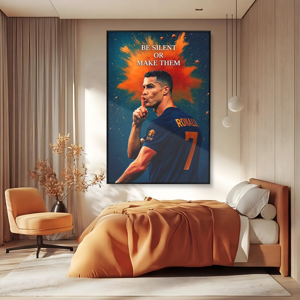 Tablou canvas cu tablou motivational cu portretul lui ronaldo, in rama de aluminiu negru, pe perete intr-un dormitor