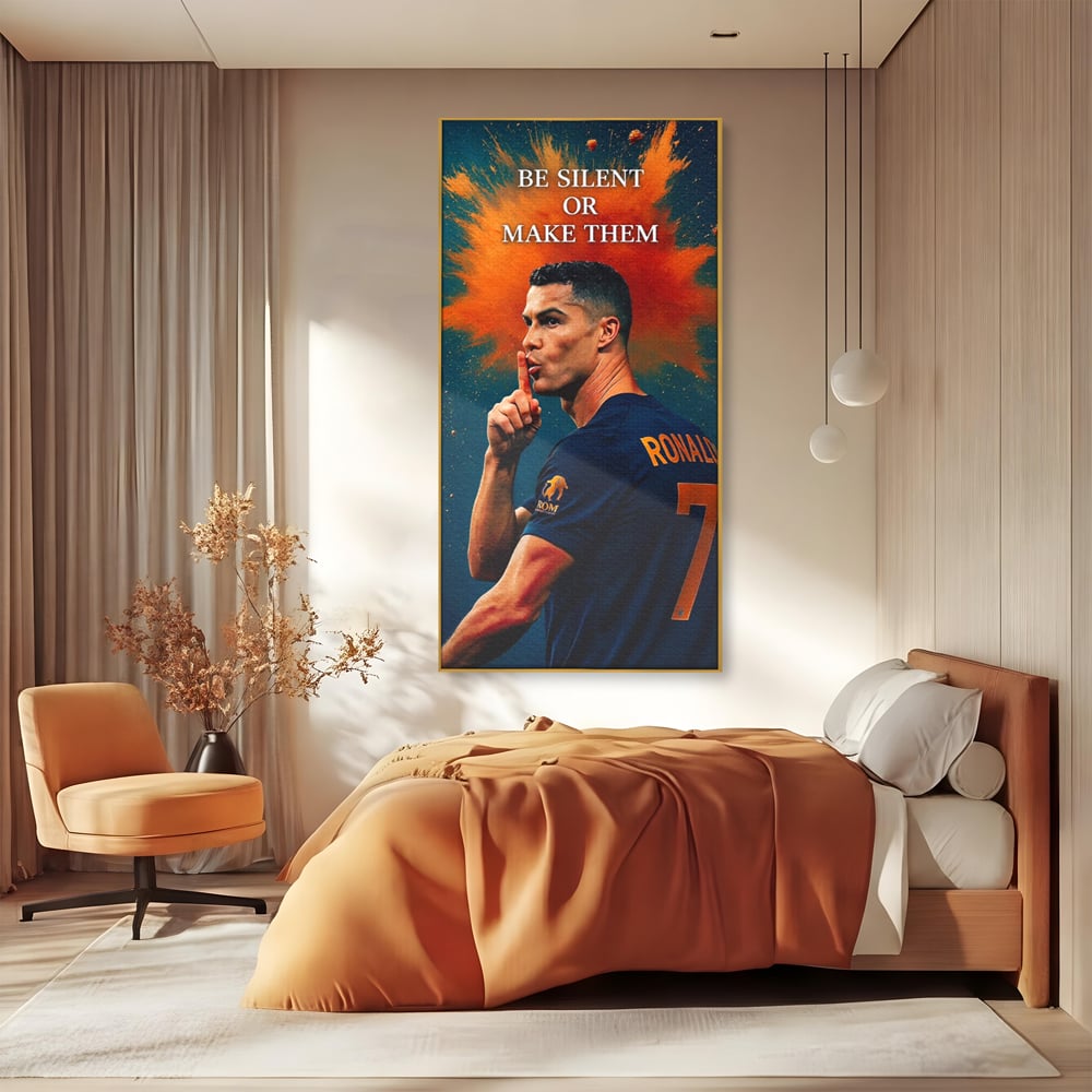Tablou canvas cu tablou motivational cu portretul lui ronaldo, in rama de aluminiu auriu, pe perete intr-un dormitor
