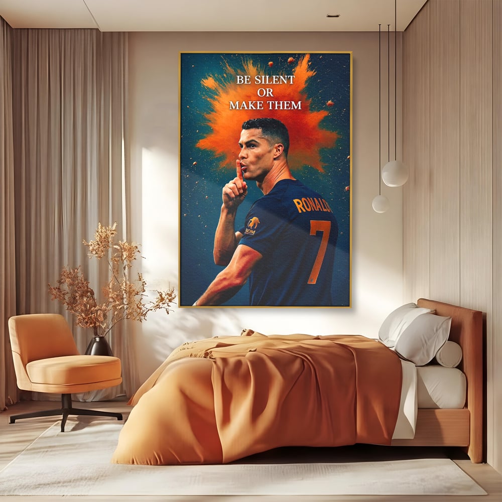 Tablou canvas cu tablou motivational cu portretul lui ronaldo, in rama de aluminiu auriu, pe perete intr-un dormitor
