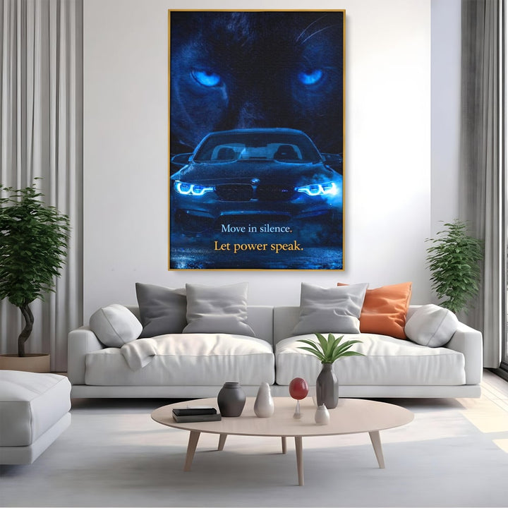 Tablou canvas cu tablou canvas cu pantera si masina bmw, in rama de aluminiu auriu, pe perete intr-un living