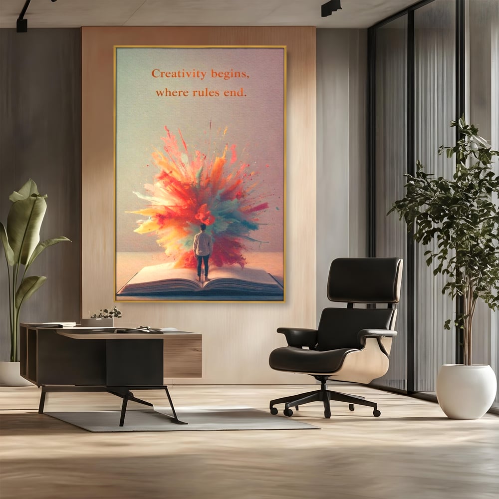 Tablou canvas cu tablou canvas cu barbat privind o explozie de culoare dintr-o carte deschisa, in rama de aluminiu auriu, pe perete intr-un birou
