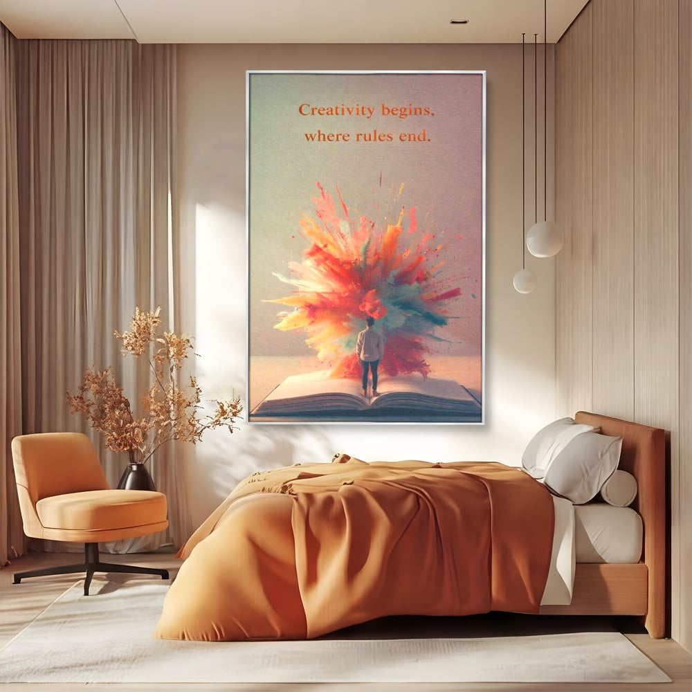 Tablou canvas cu tablou canvas cu barbat privind o explozie de culoare dintr-o carte deschisa, in rama de aluminiu argintiu, pe perete intr-un dormitor