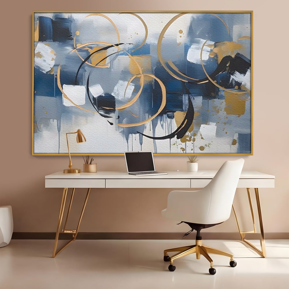 Tablou canvas cu pictura abstracta cu cercuri aurii si albastre, in rama de aluminiu auriu, pe perete intr-un birou