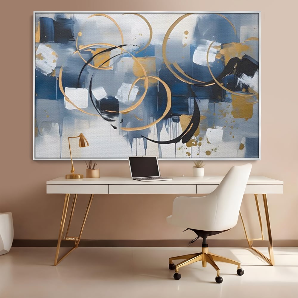 Tablou canvas cu pictura abstracta cu cercuri aurii si albastre, in rama de aluminiu argintiu, pe perete intr-un birou