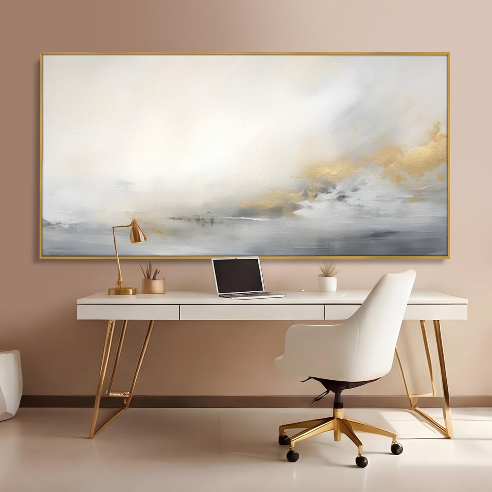 Tablou canvas cu tablou abstract cu ceata si nuante aurii, in rama de aluminiu auriu, pe perete intr-un birou