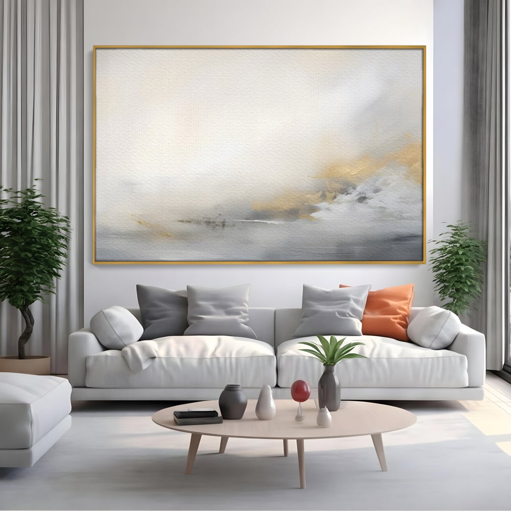 Tablou canvas cu tablou abstract cu ceata si nuante aurii, in rama de aluminiu auriu, pe perete intr-un living