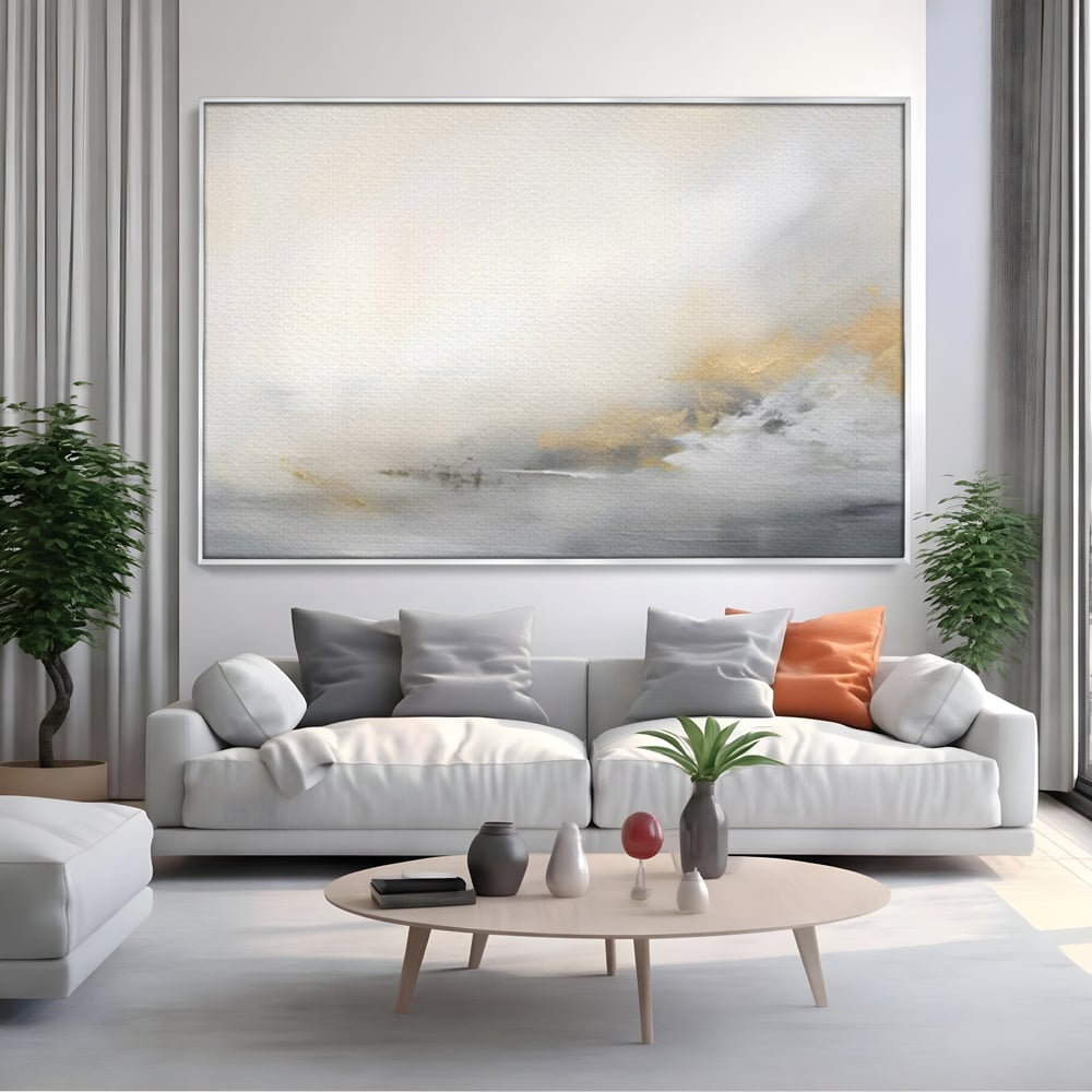 Tablou canvas cu tablou abstract cu ceata si nuante aurii, in rama de aluminiu argintiu, pe perete intr-un living