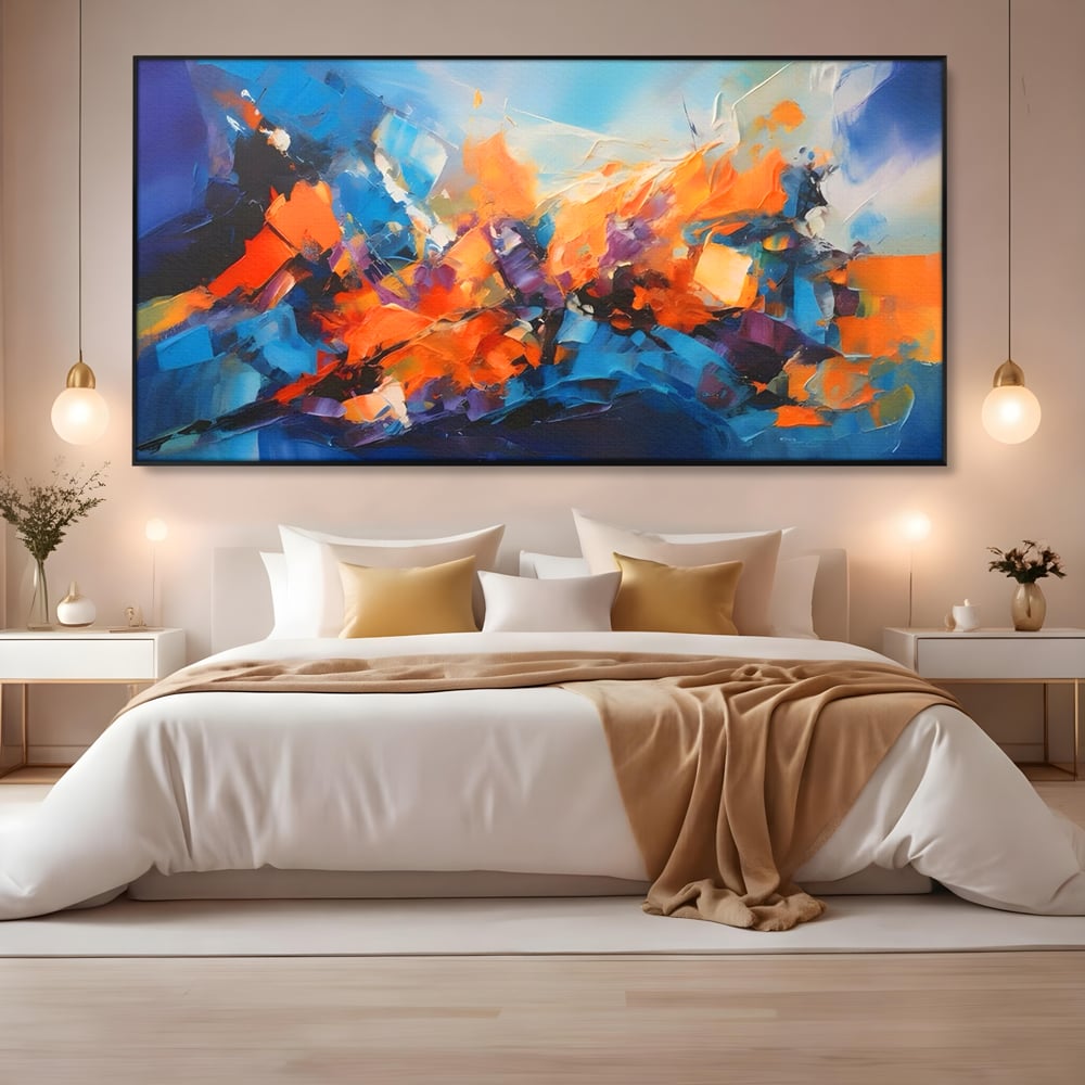 Tablou canvas cu pictura abstracta cu pete portocalii, in rama de aluminiu negru, pe perete intr-un dormitor