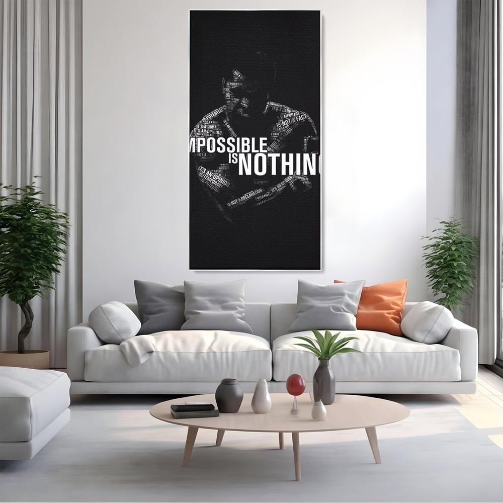 Tablou canvas cu tablou canvas cu silueta masculina si text motivational, in rama de aluminiu argintiu, pe perete intr-un living