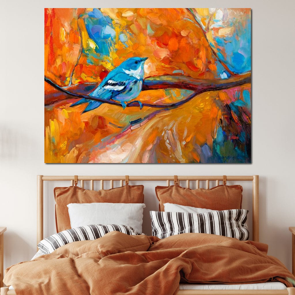 tablou canvas cu o pasare albastra pe creanga, in peisaj de toamna colorat