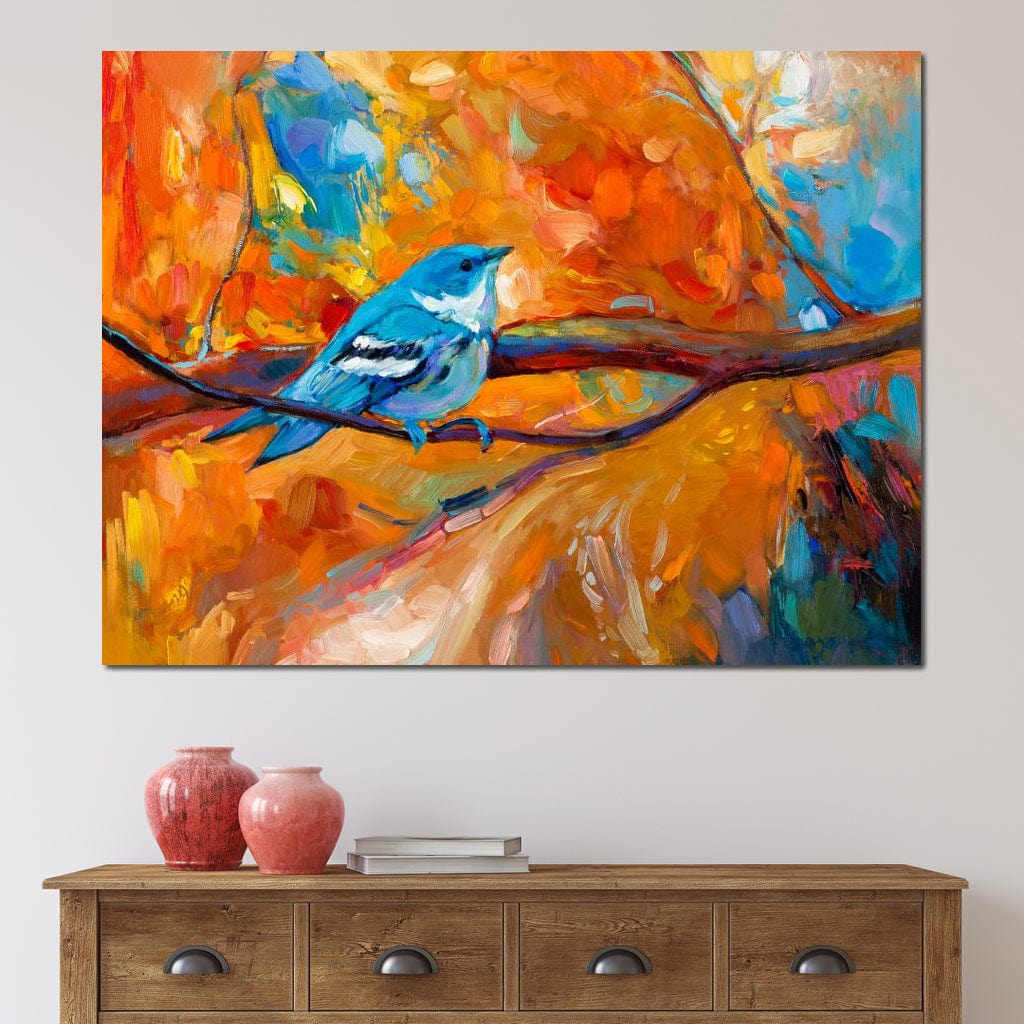 tablou canvas cu o pasare albastra pe creanga, in peisaj de toamna colorat