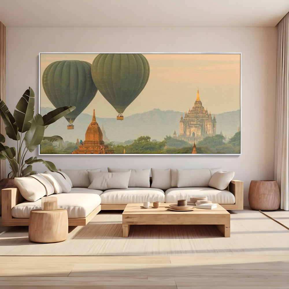 Tablou canvas cu tablou canvas cu peisaj din bagan, in rama de aluminiu argintiu, pe perete intr-un living